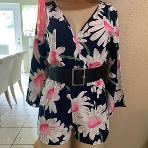 Blue romper with big flower print
